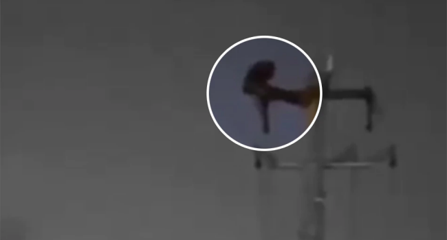Chinese Man Does Sit-ups Atop Power Post, Causes Blackout
