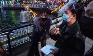 vlogger swimming in fountain