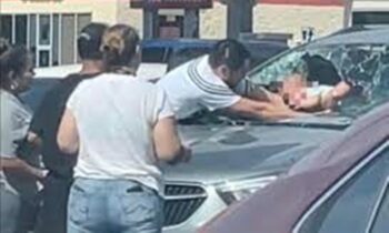 father breaks windshield