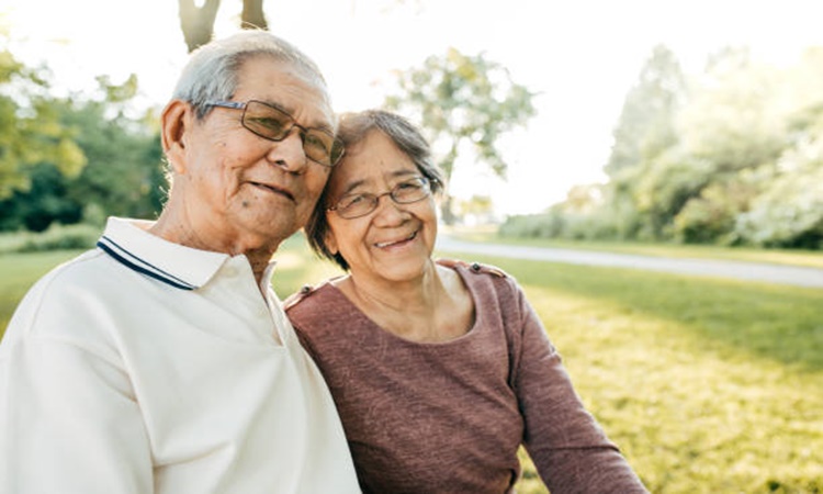 Seniors couple walking in the park