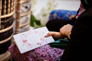 Woman Opening Wedding Invitation