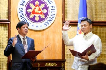Education Secretary Sonny Angara taking his oath before President Ferdinand Marcos Jr. in Malacanang