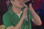 OPM singer Bamboo Mañalac singing into a microphone on stage