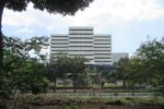 Bureau of Internal Revenue National Office building in Quezon City seen behind trees