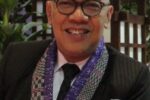 TV host Boy Abunda smiling in a dark suit