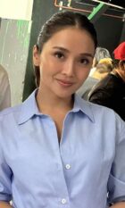 Actress Kathryn Bernardo smiling in a light blue button-down shirt