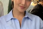 Actress Kathryn Bernardo smiling in a light blue button-down shirt