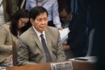 Senator Panfilo Lacson seated at a Senate hearing