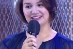 Nadine Samonte smiling while holding a microphone during a TV guesting