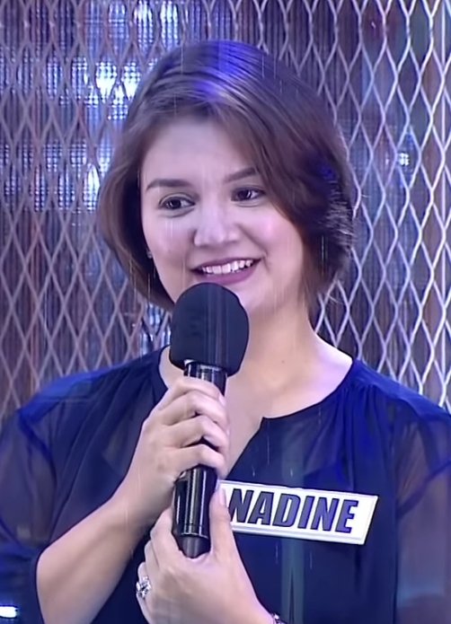 Nadine Samonte smiling while holding a microphone during a TV guesting