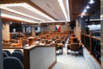 Empty session hall of the Senate of the Philippines with the Philippine flag at the rostrum