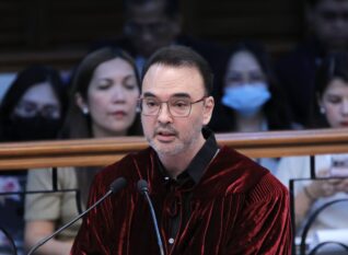Senator Alan Peter Cayetano in senator-judge robe speaking at the Senate impeachment court