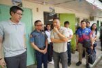 Education Secretary Sonny Angara with school and local officials during a DepEd school visit