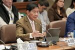 Sen. Panfilo Lacson speaking into a microphone during a Senate committee hearing