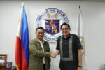 Education Secretary Sonny Angara shaking hands with Sen. Bam Aquino in front of the Department of Education seal