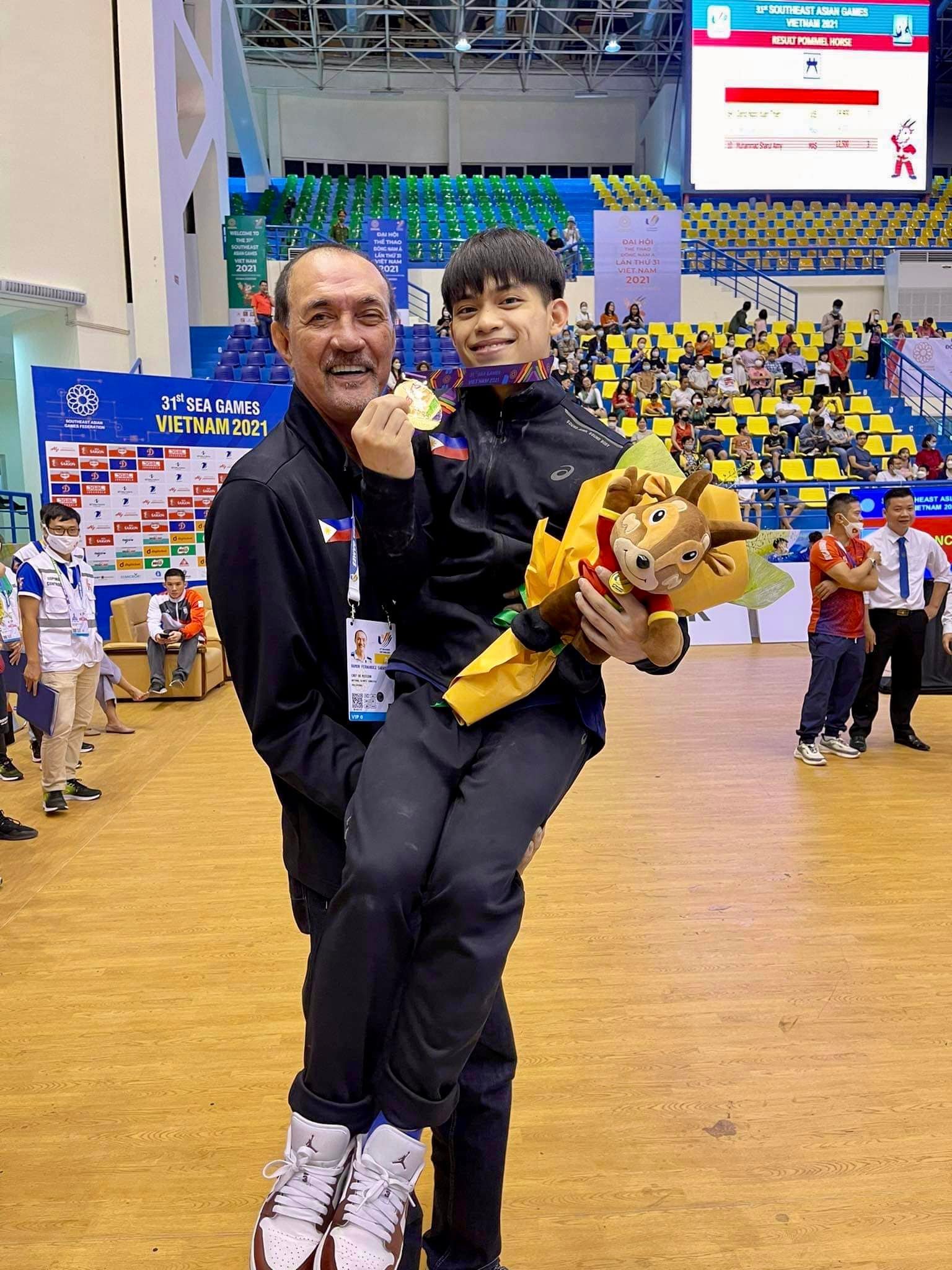 Gymnast Carlos Yulo smiling at a SEA Games venue